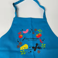 Children's apron turquoise – a colourful apron with the Gewürzamt motif for children