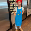 Children's apron turquoise worn – robust for cooking, baking and crafting