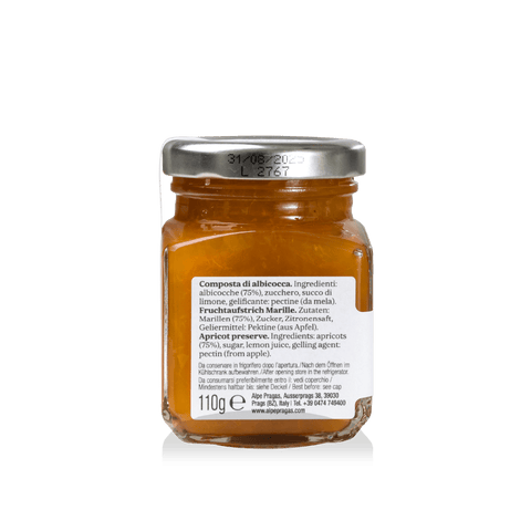 Apricot fruit spread opened, creamy texture with golden-yellow fruit pieces