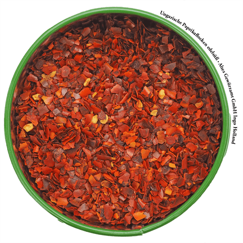 Hungarian sweet paprika flakes close-up of the red flakes